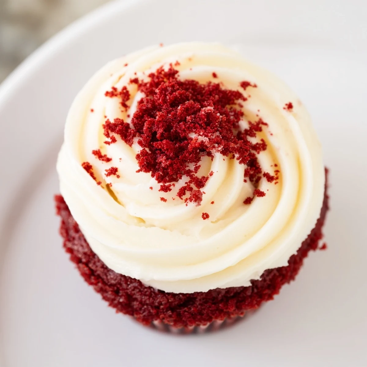 A close-up of delicious red velvet cupcakes, frosted and ready to eat, a sweet treat.