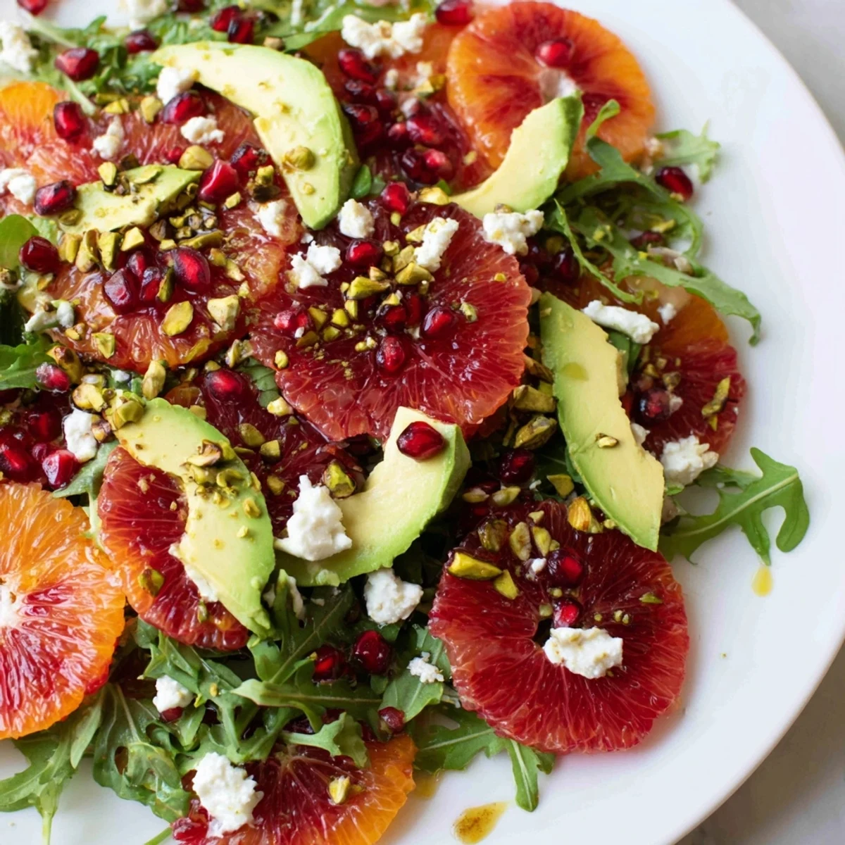 Freshly assembled Winter Citrus Salad with Pomegranate Vinaigrette, ready for a delicious and healthy bite.