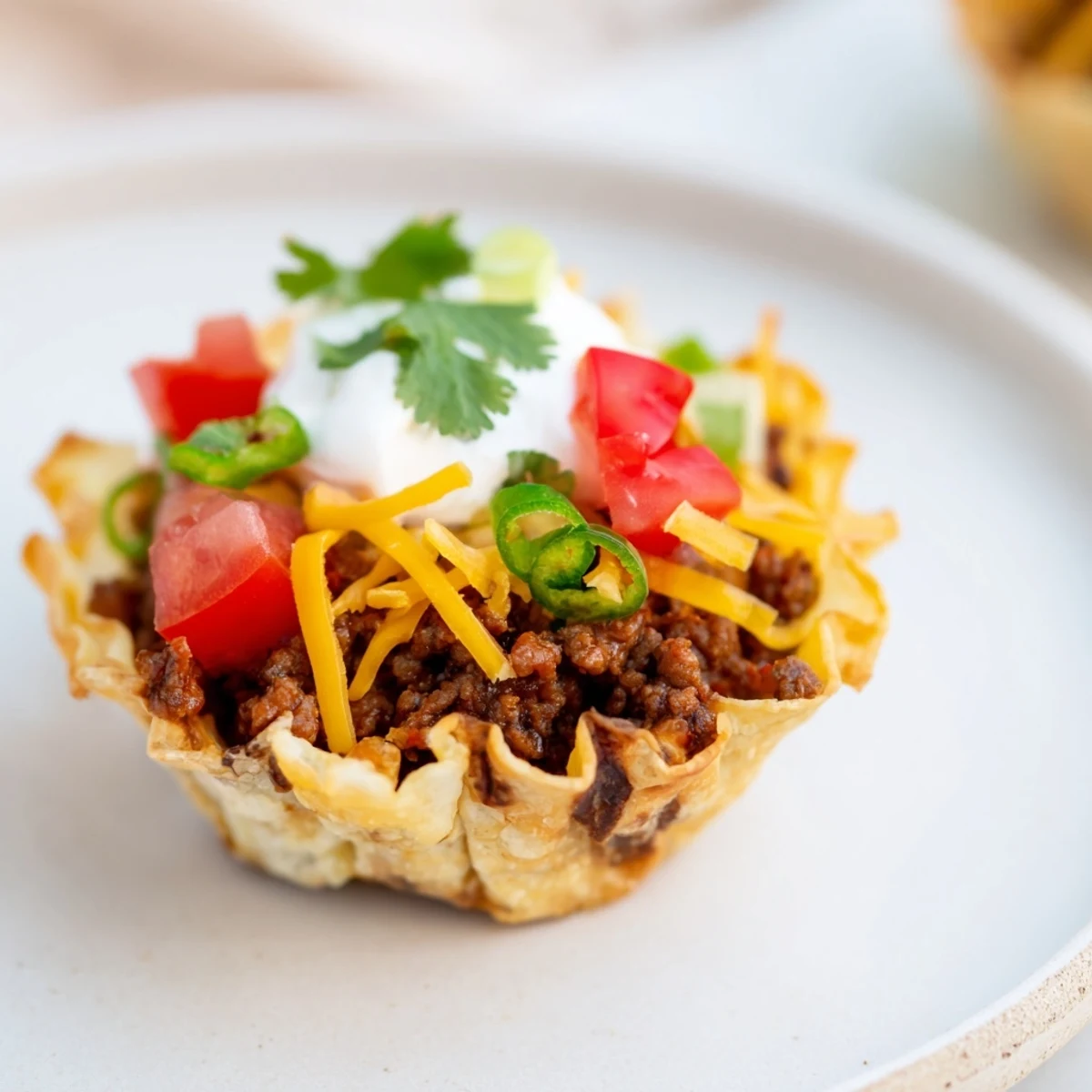 Golden, crispy Taco Cups with ground beef and melted cheese, fresh from the oven.