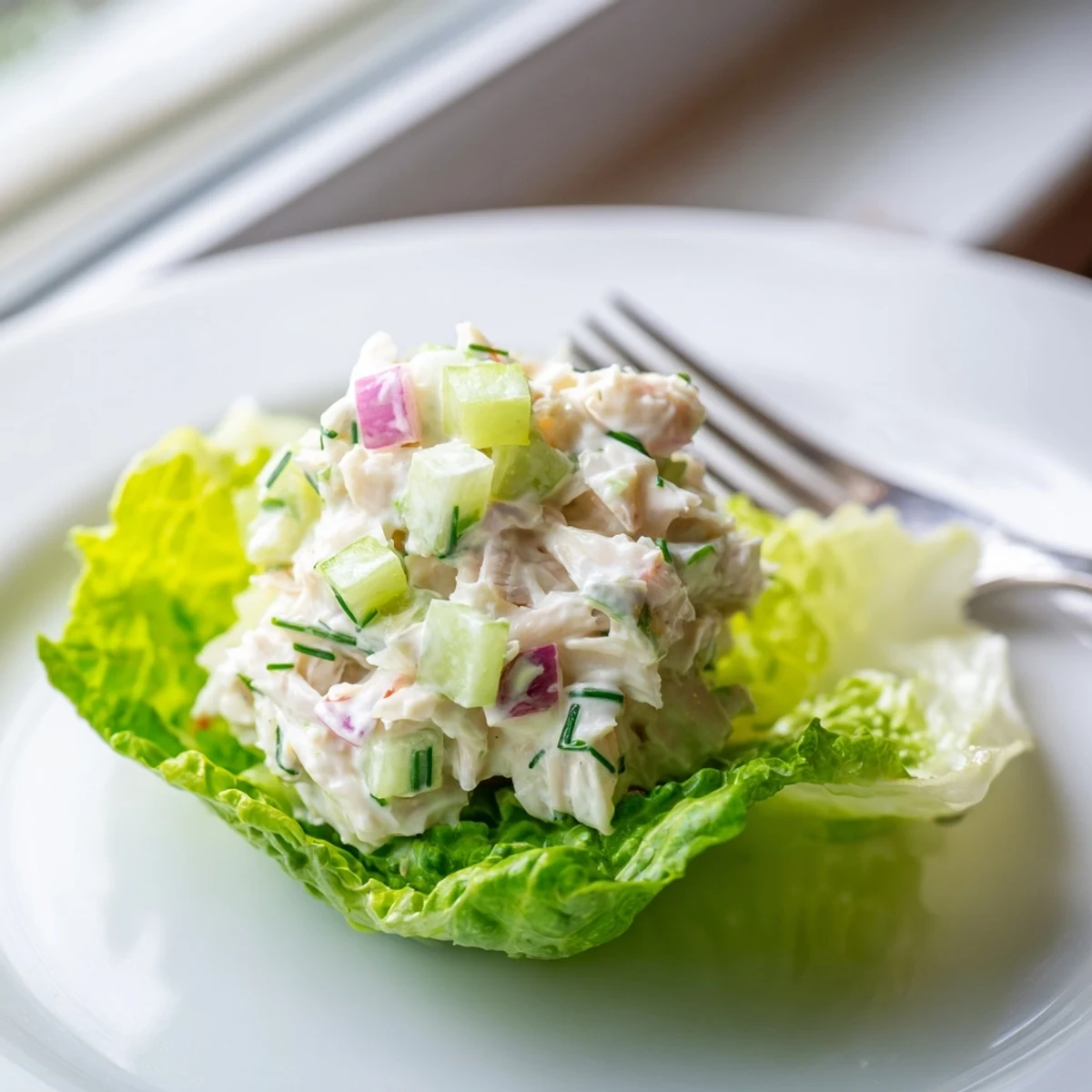 Fresh lump crab salad with creamy dressing served on crisp butter lettuce leaves.