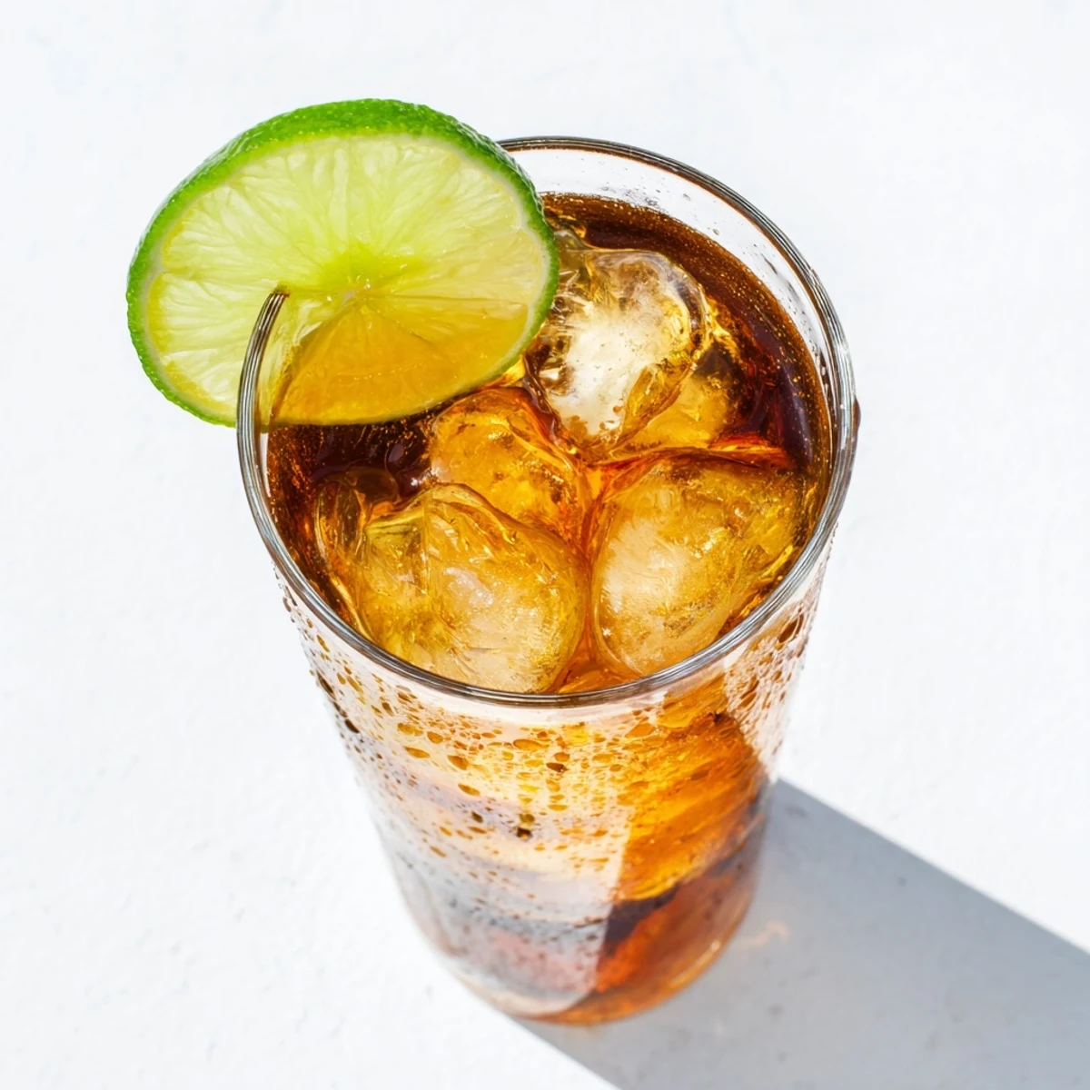Refreshing Thai lime iced tea with vibrant citrus notes and sweetened black tea poured over ice