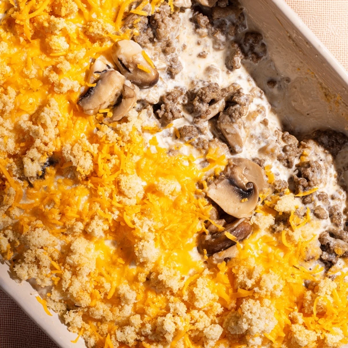 Creamy ground beef and mushroom casserole baked to perfection with cheesy golden crust