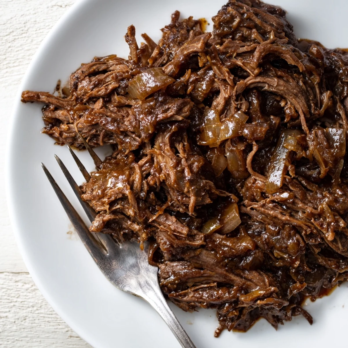 Savory slow-cooked Crock Pot shredded beef with aromatic spices and rich broth