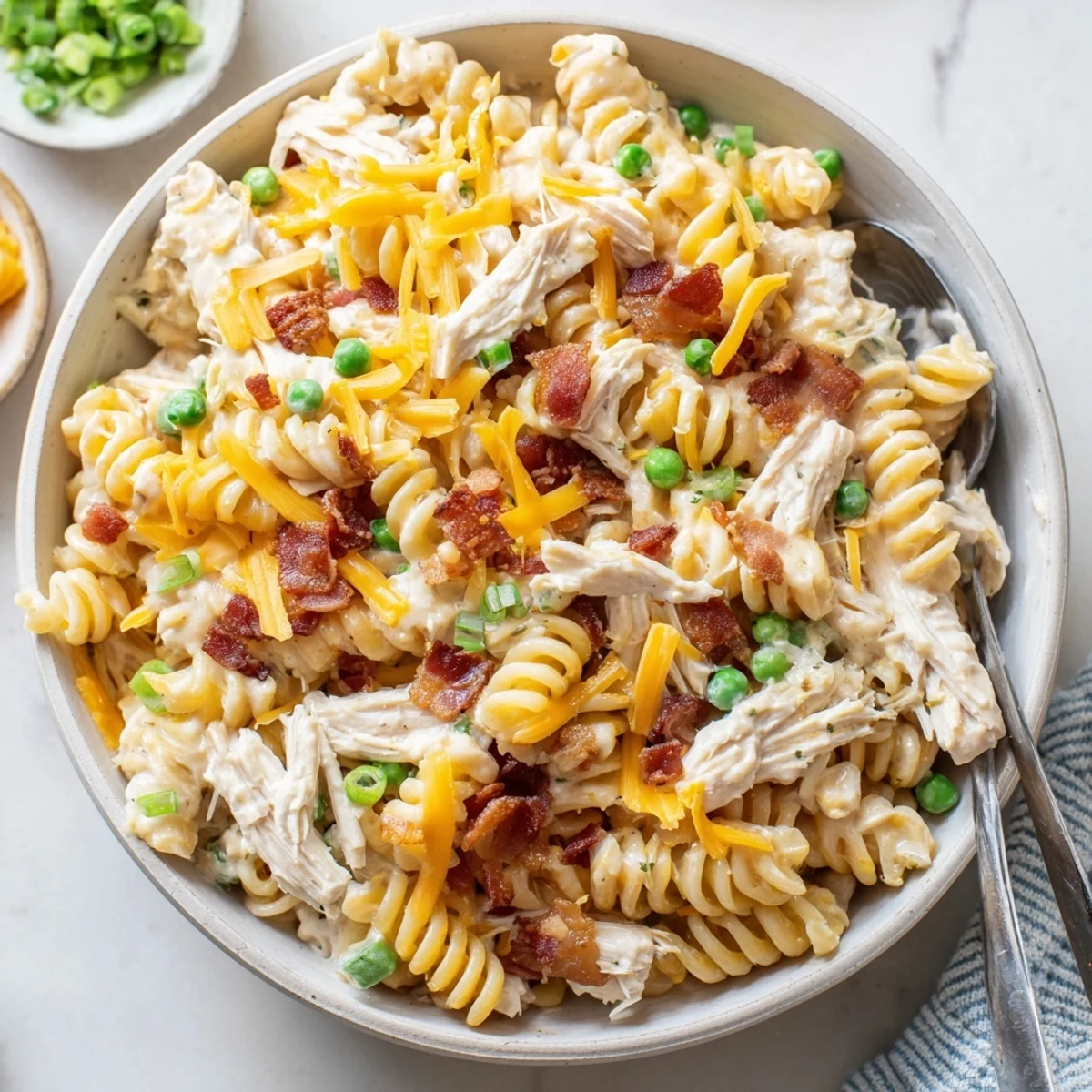 Golden slow cooker crack chicken casserole loaded with ranch seasoned pasta and savory cheese