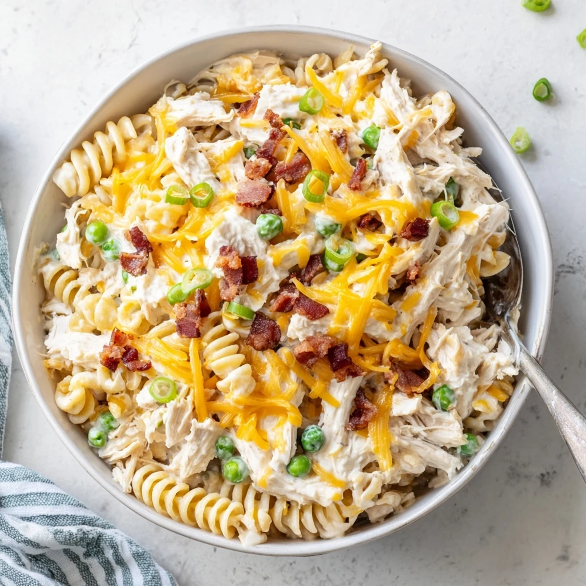 Sizzling Crock Pot crack chicken casserole bubbling with tender pasta shredded chicken and bacon