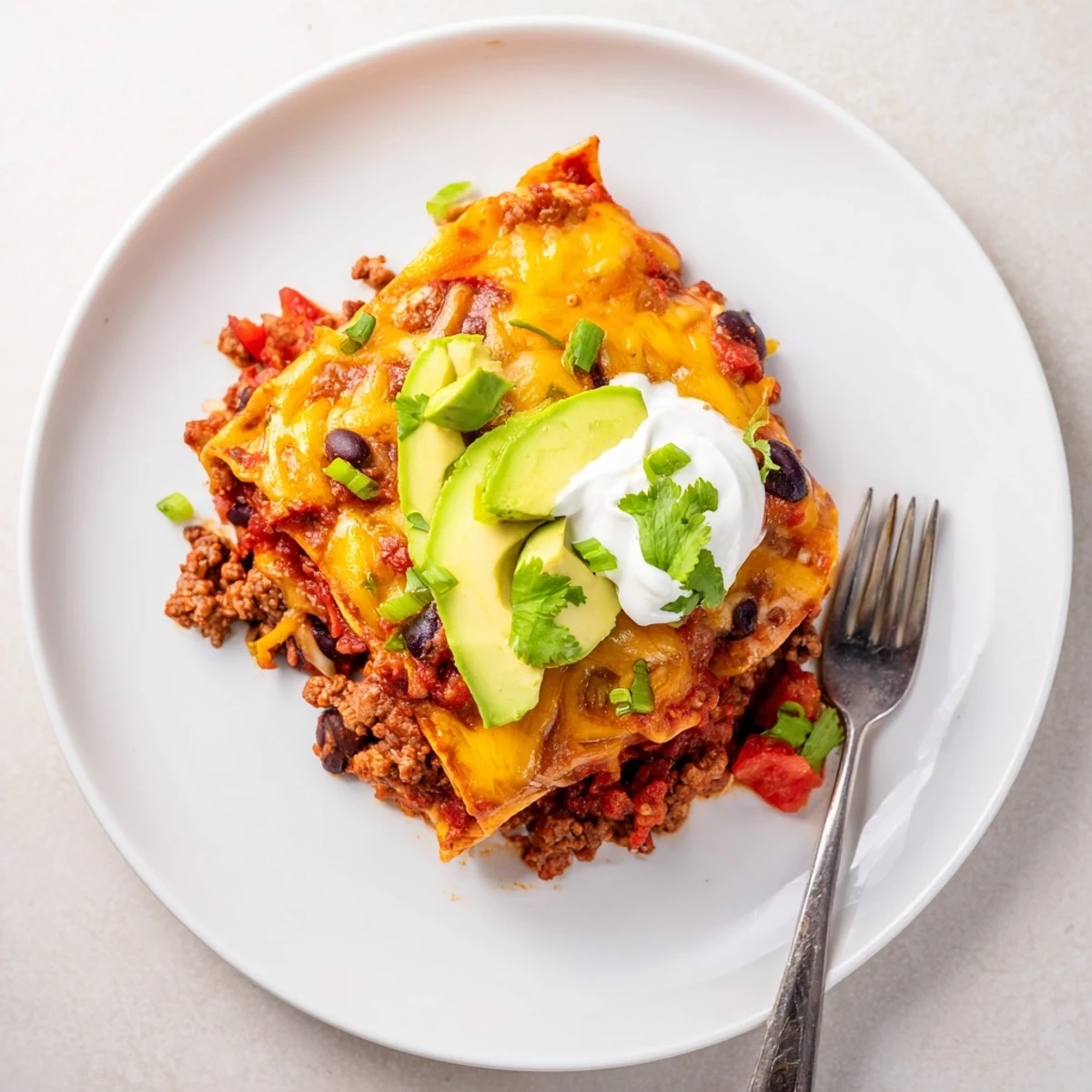 One pan Beef Skillet Enchiladas with browned beef, smoky spices, crispy edges