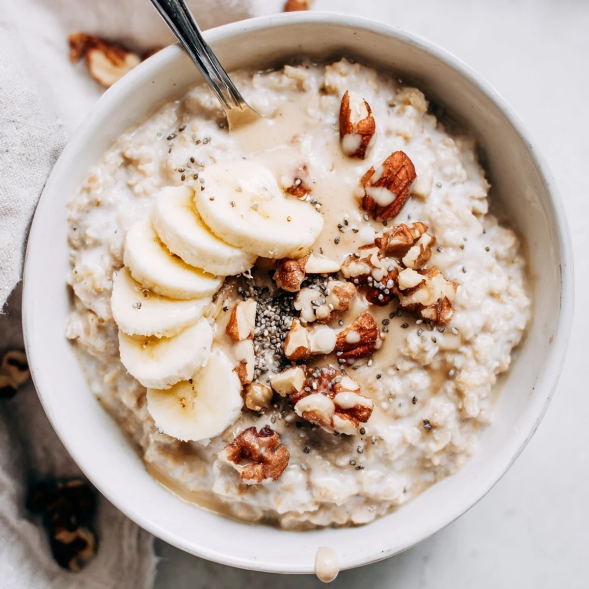 Creamy Protein Oatmeal steaming in bowl, hint of maple syrup