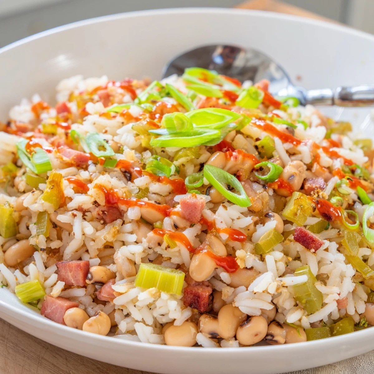 Hearty Smoky Southern Hoppin John steaming over rice, smoky bacon aroma  