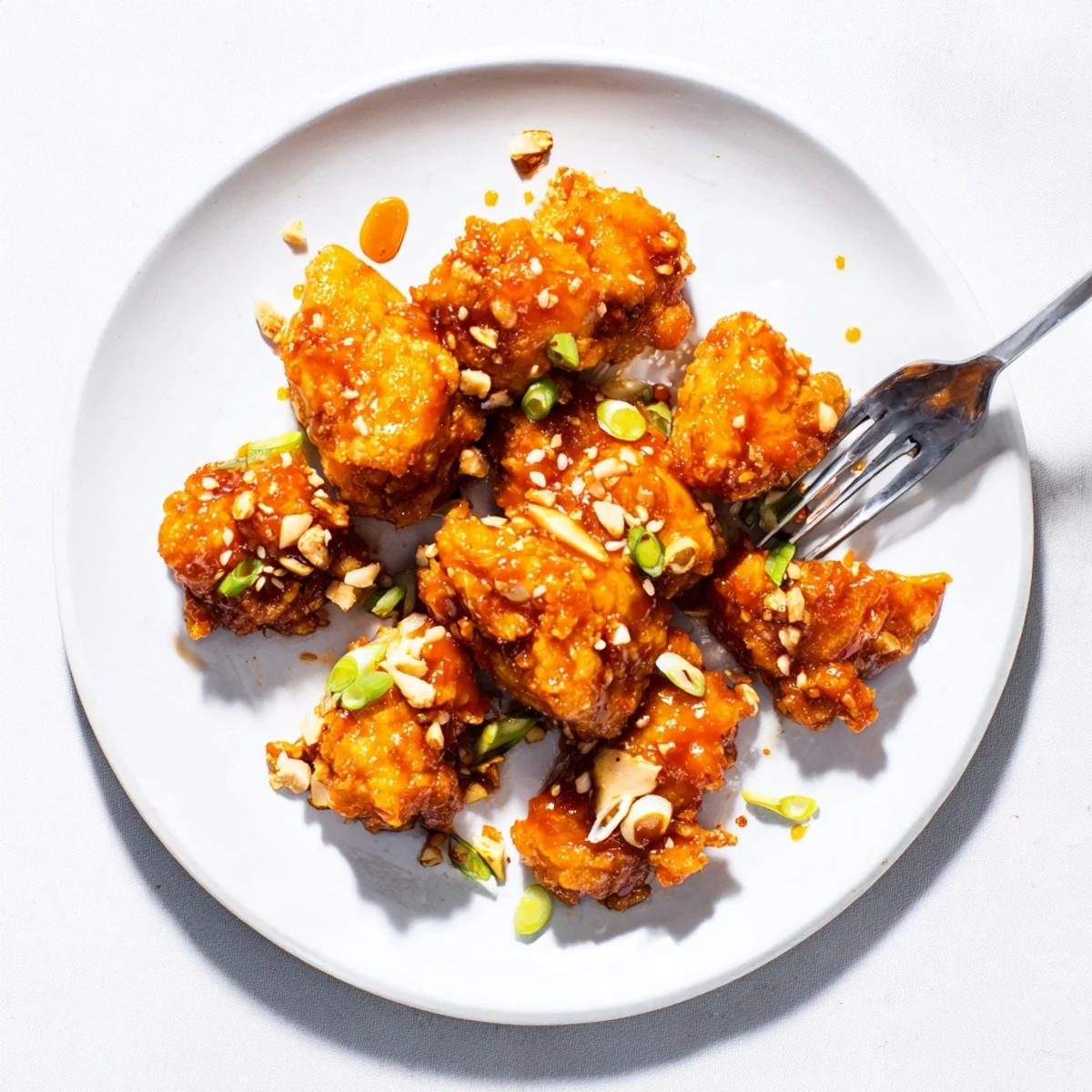 Chinese-American orange chicken dish featuring crunchy coated bites smothered in vibrant savory orange glaze