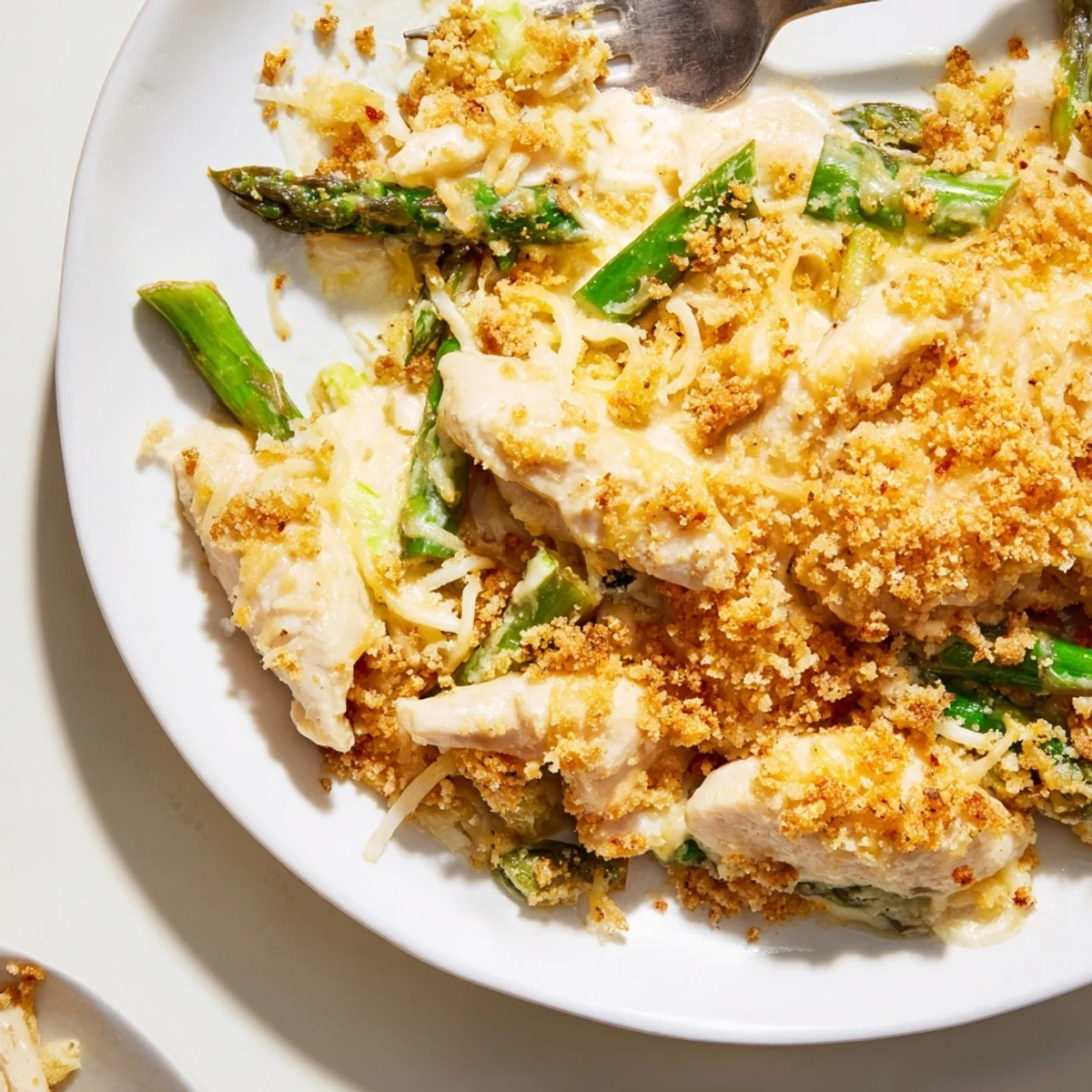 Ready to serve Creamy Chicken Asparagus Bake steaming with creamy sauce, crisp asparagus tips