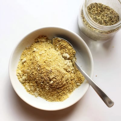 Spoonful of Vegan Chicken Seasoning For Rubs Marinades And Broth, savory herbaceous umami.