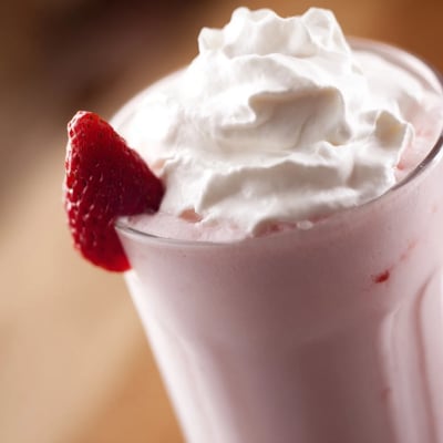 Creamy delicious strawberry milkshake recipe blended with ripe red berries and vanilla ice cream for a thick texture.  